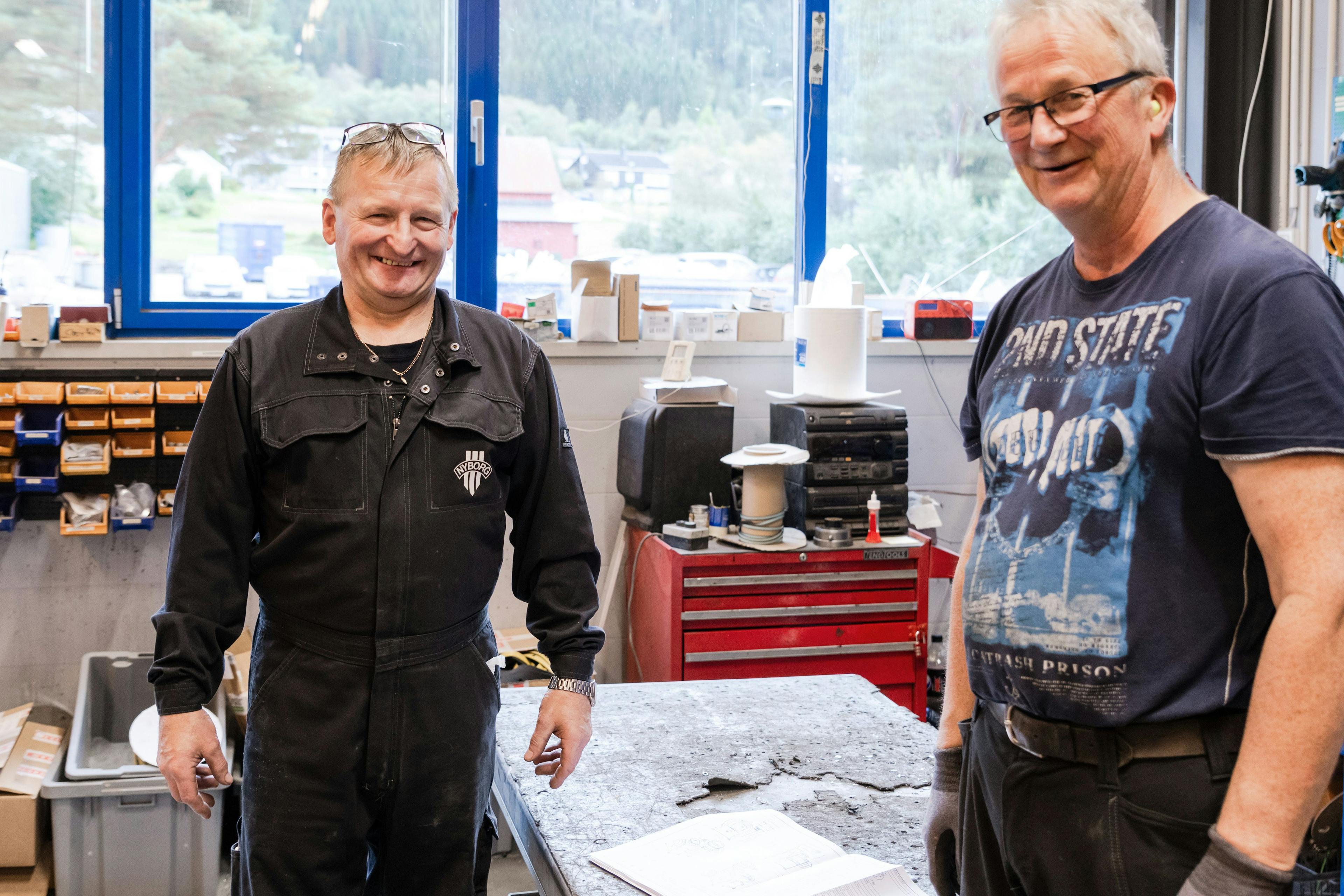 Workers smiling in workshop